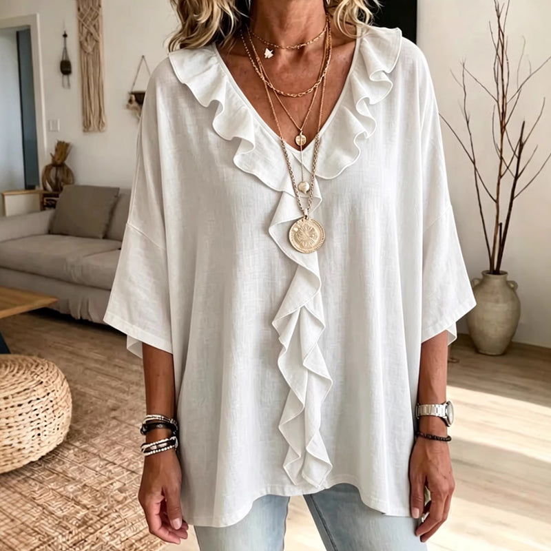 Nelio – Elegant bluse med V-hals og flæser