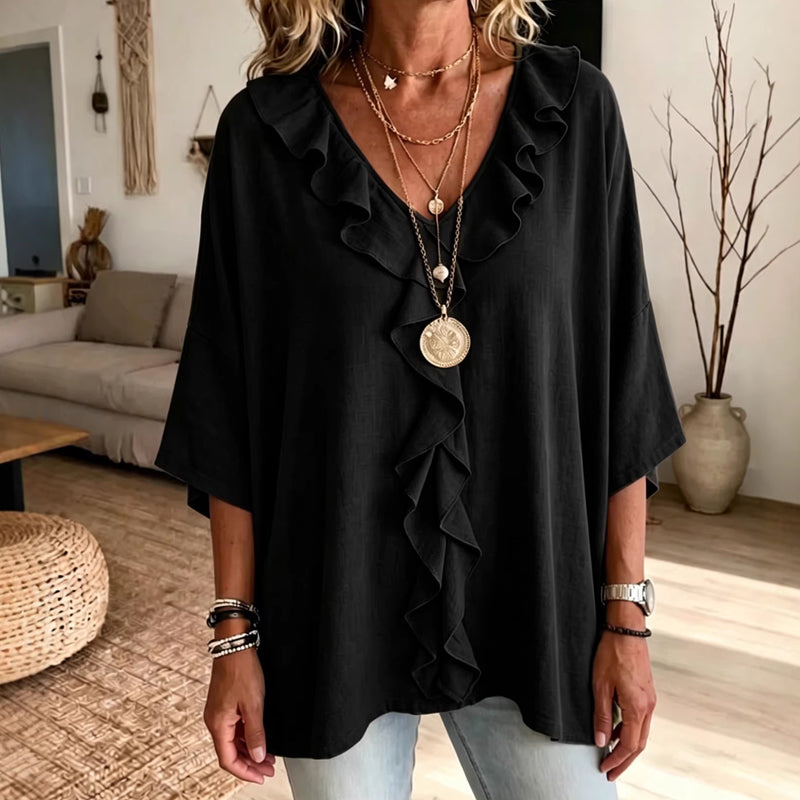Nelio – Elegant bluse med V-hals og flæser